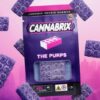 Cannabrix The Purps cannabis-infused gummies with 400mg THC, displayed against a vibrant pink and purple background.