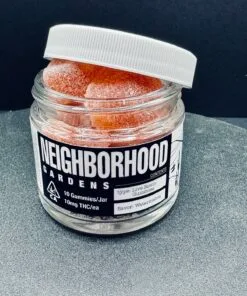 Jar of Neighborhood Gardens Live Rosin Gummies, watermelon flavor, 10mg THC each, on a gray surface.
