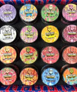 Colorful array of Pack Man cannabis concentrates in a stylish box, showcasing various enticing flavors and designs.