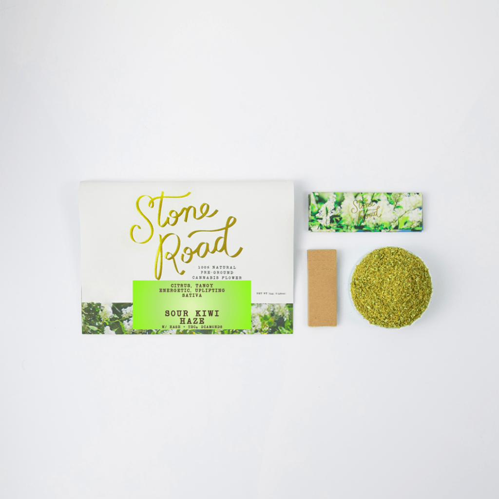 Stone Road cannabis flower package featuring Sour Kiwi Haze strain with a colorful design and rolling papers.