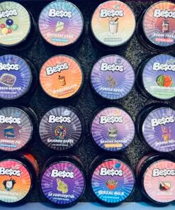 Variety of Besos live resin sugar containers in vibrant flavors like Birthday Cake, Mango, and Purple Kush.