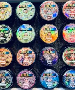 Colorful ASTRO-NAUT ice cream containers with unique flavors arranged in a neat grid on a black background.