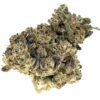 Close-up of vibrant cannabis buds showcasing green hues and purple accents, ideal for discussing strains and effects.