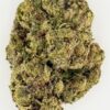 Close-up of a cannabis bud showcasing its unique texture and vibrant green colors against a white background.