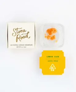 Alt text: Stone Road cannabis concentrate packaging with Lemon Jack sativa sugar in a clear container.