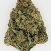 Close-up of green cannabis bud with a dense texture, showcasing its natural color and trichomes on a white background.