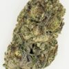 Close-up of a dense cannabis bud showcasing vibrant green hues and frosty trichomes, ideal for medical or recreational use.