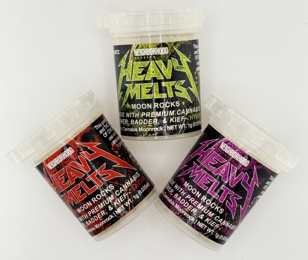 Three containers of Heavy Melts moon rocks featuring premium cannabis, badder, and kief in vibrant packaging.