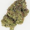 Close-up of a dense cannabis bud showcasing rich green hues and sparkling trichomes on a white background.